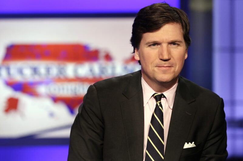 Tucker Carlson, host of "Tucker Carlson Tonight," poses for photos in a Fox News Channel studio, in New York, Thursday, March 2, 2107. (AP Photo/Richard Drew)